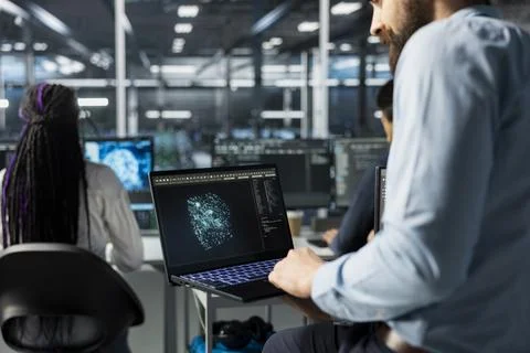 Close up of server hub system administrator optimizing performance with AI Stock Photos