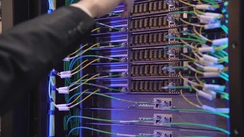 Close up of server racks in a data center used for ai with cables and plugs. Stock Footage 330398685