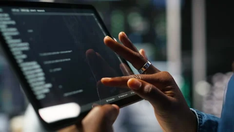 Close up of server room programmer checking coding on tablet Stock Footage 307020124