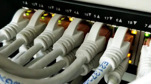 Close up of Server Switch Ethernet with Lights Blinking and Cables Stock Footage 129848553