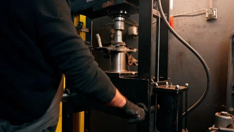 Close-up in a service station the hands of an auto mechanic work with disk from Stock Footage 276110920