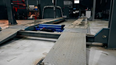 Close-up of a service station platform with a rail onto which lifting machine Vidéo 276111028
