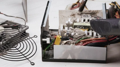 Close-up service worker cleans the PC power supply unit from dust and dirt with Stock Footage 105590988