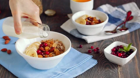 Close up of serving and consuming granola breakfast Stock Footage 61320315