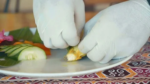 Close up of serving fish in banana leaf Stock Footage 84988191