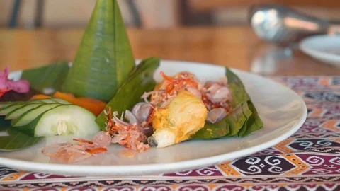 Close up of serving fish in banana leaf Stock Footage 84991788