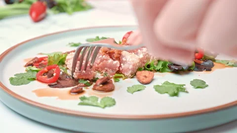 Close-up of serving with a fork and knife Sesame Crusted Tuna, Seared Tuna in 4K Stock Footage 141315015