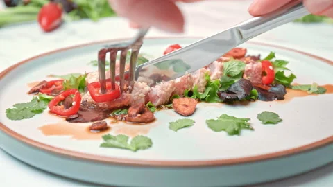 Close-up of serving with a fork and knife Sesame Crusted Tuna, Seared Tuna in 4K Stock Footage 141315061