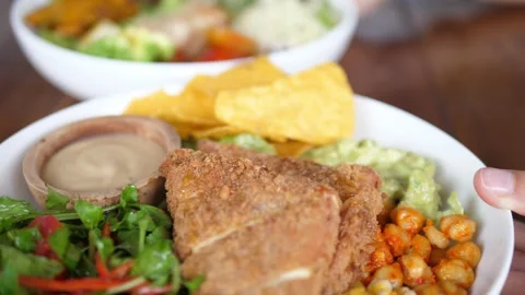 Close up of serving plates with balanced nutritious vegan meals full of Stock Footage 154440761