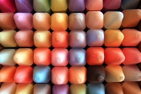Close up of a set of colored crayons with a square shape and round tip Stock Photos