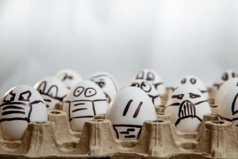 Close up of set of Easter eggs with drawn medical masks and emotions. copy sp Stock Photos