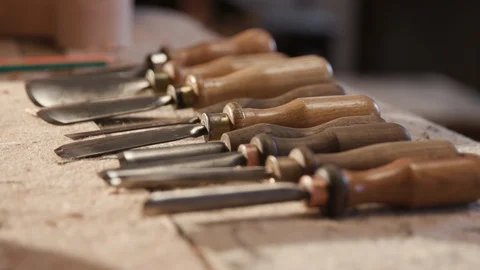 Close Up of a set of hand tools for Carving. Wood Carver working. Male Wood Stock Footage 112627644