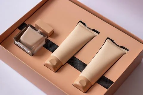 Close-up of a set of perfumed water, cream-colored shower gel in a gift box 写真素材