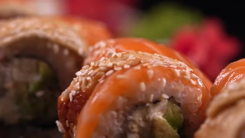 Close-up of a set of sushi rotating on a plate. Stock Footage 311720938