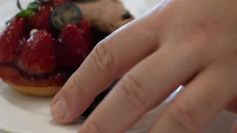 Close up to set of sweet dessert cake and macaroon while using hand to grab.. Stock Footage 278264536
