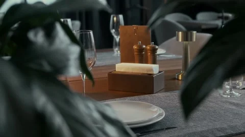 Close-up of a set table in a restaurant with wine glasses Stock Footage 315231493