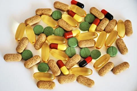 Close-up of a set of vitamins in tablets and capsules. The topic of health ca Stock Photos
