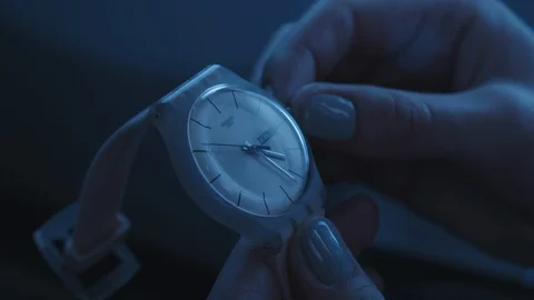 Close up of setting the clock on time in airplane. Female hand and fingers in Stock Footage 126911245