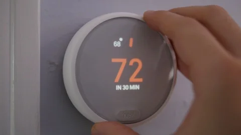 Close Up Setting Smart Thermostat to 72 Degrees 스톡 동영상 99518196