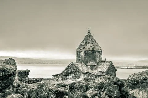Close up Sevanavank monastic complex building with Sevan lake panorama. Pen.. Stock Photos