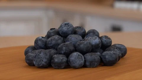 Close up of several blueberrie berries. Rotating camera in the kitchen Stock Footage 89808951