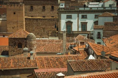 Close-up of several old building rooftops and chimneys at Caceres Stock Photos