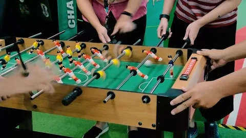 Close up of several people playing table football table football Stock Footage 270278015