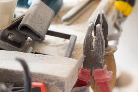 Close-up of several pliers on a carpentry table, selective focus Stock Photos