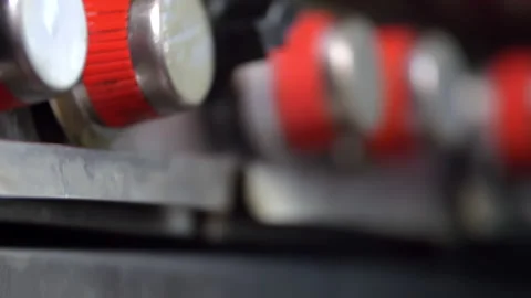 Close-up of several red and silver stove knobs 스톡 동영상 149120376