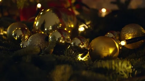 Close up of several red plastic Christmas toys hanging on an artificial Stock Footage 144461611