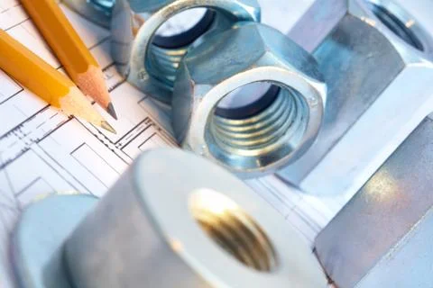 Close-up of several screw-threads and two pencils over house project Stock Photos