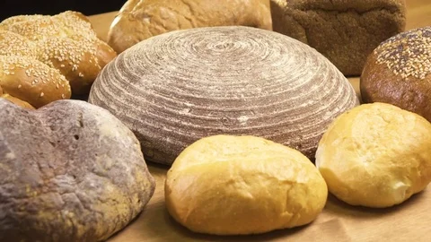 Close-up. Several types of bread lie on the table Stock Footage 76425213