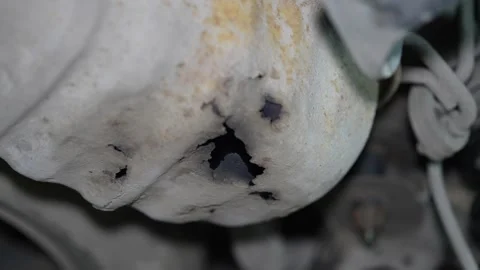 Close-up of a severe rust hole corrosion in car underbody metal. Video stock 345912603