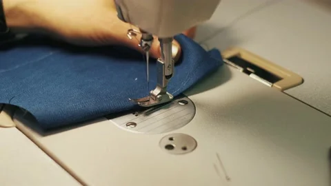 Close-up of sewing machine and fabric Stock Footage 152954592