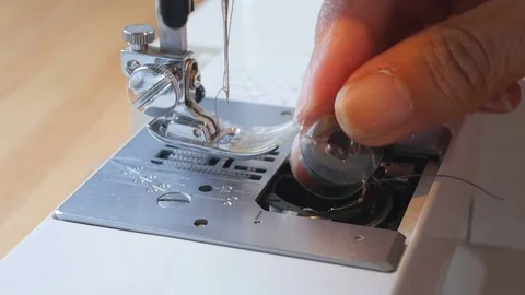 Close up of sewing machine being prepared for use Stock Footage 77852529