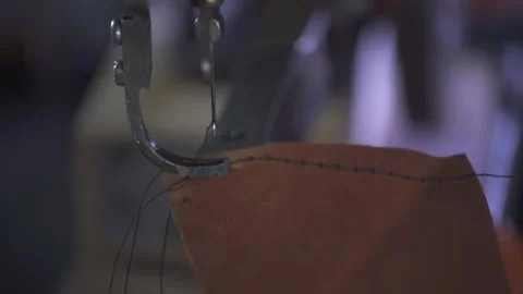 Close-up Sewing Machine Needle in Motion. Tailor master in factory of clothes. Stock-Footage 130215833