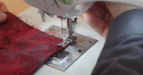 Close-up of Sewing Machine Needle in Motion: the  needle rapidly moves up and Stock Footage 130466740