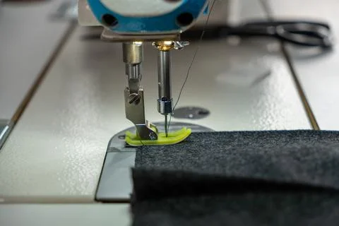 Close up of sewing machine needle movement during stitching Stock Photos