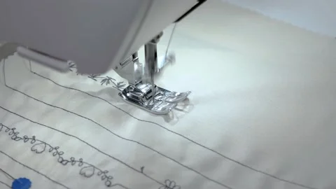 Close-up of a sewing machine needle moving rapidly up and down. In a sewing Video stock 141355688