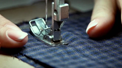 Close-up of sewing machine needle rapidly moves up and down Stock Footage 68972042