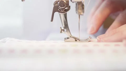 Close-up of sewing machine needle running over fabric Stock Footage 146921932