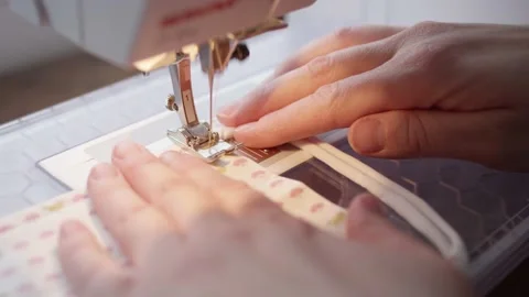 Close-up of sewing machine needle running over fabric Stock-Footage 146923227