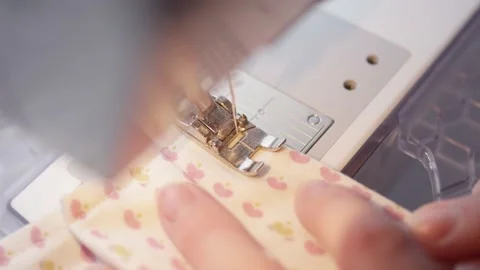 Close-up of sewing machine needle running over fabric Stock Footage 146924537