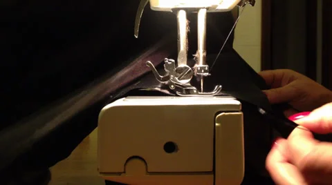 Close up on a sewing machine showing process Stock Footage 37728305
