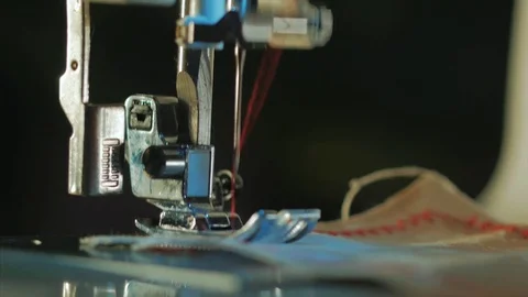 Close up on a sewing machine showing process. 4k Stock Footage