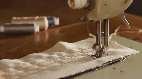 Close up on a sewing machine showing process Stock Footage 78772939