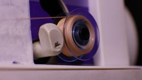 Close-up of sewing machine spindle with thread bobbin Stock Footage 345262655