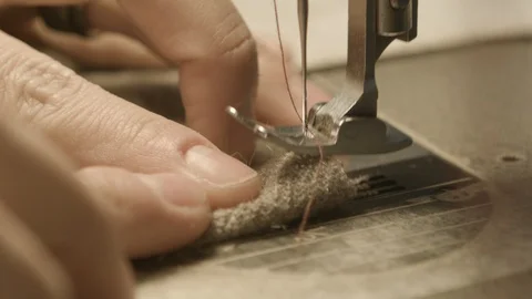 Close up sewing machine stitching garmet Video stock 124231735