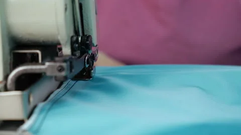 Close-up of Sewing Machine at Textile Factory. Fabric. Silk. Dress. Production Stock Footage 145044307