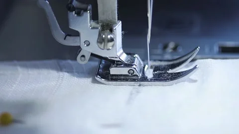 Close-up of sewing machine working with a white fabric. Stock Footage 225584225